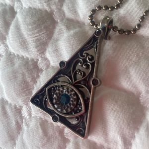 Virgins Saints & Angels evil eye pendant.
